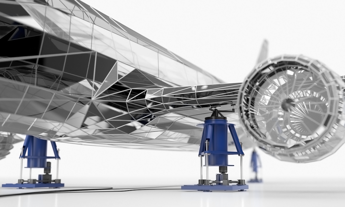 A 3D rendering of a silver plane wing resting atop a blue pneumatic isolator