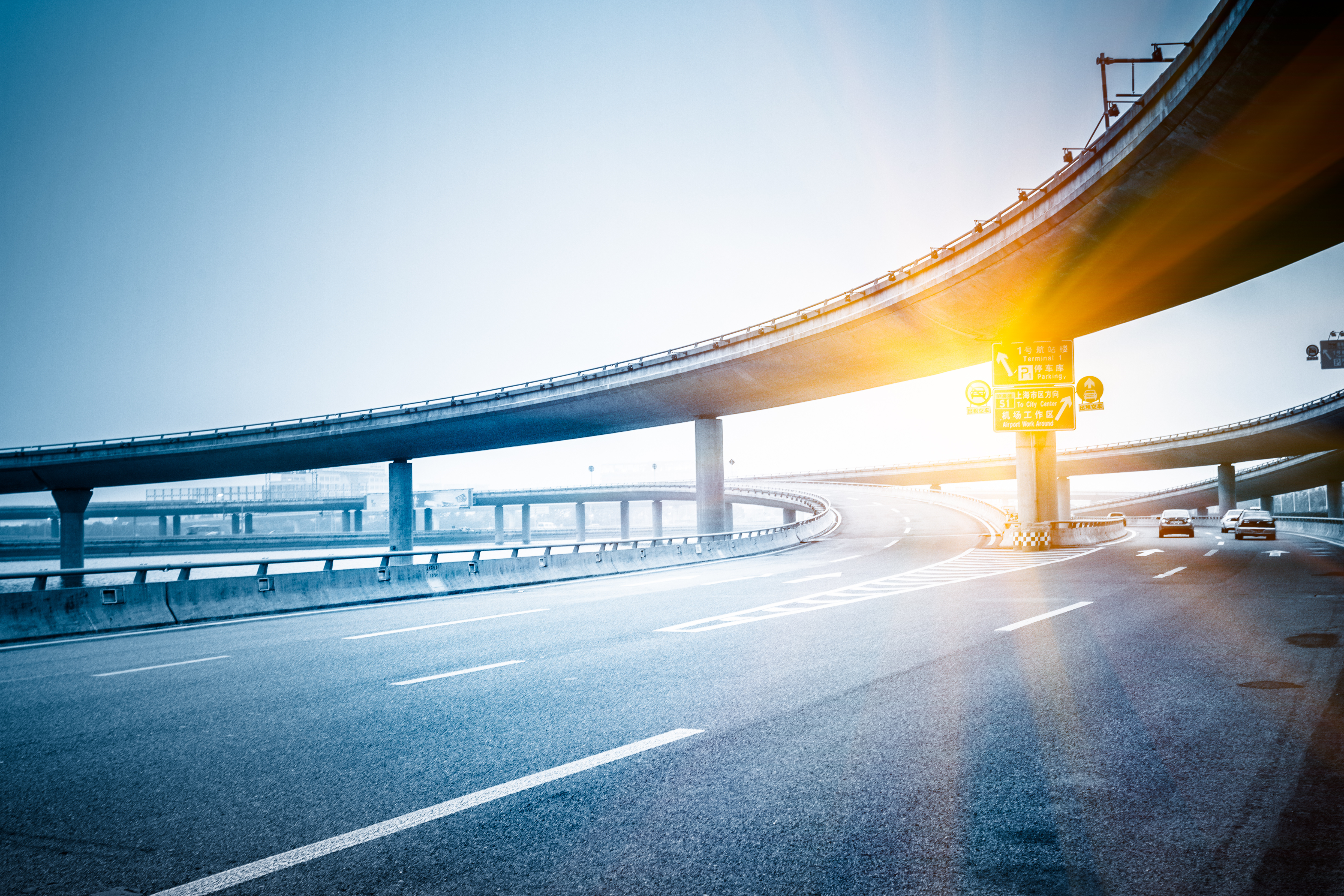 Bridge overpass with a sunset behind it