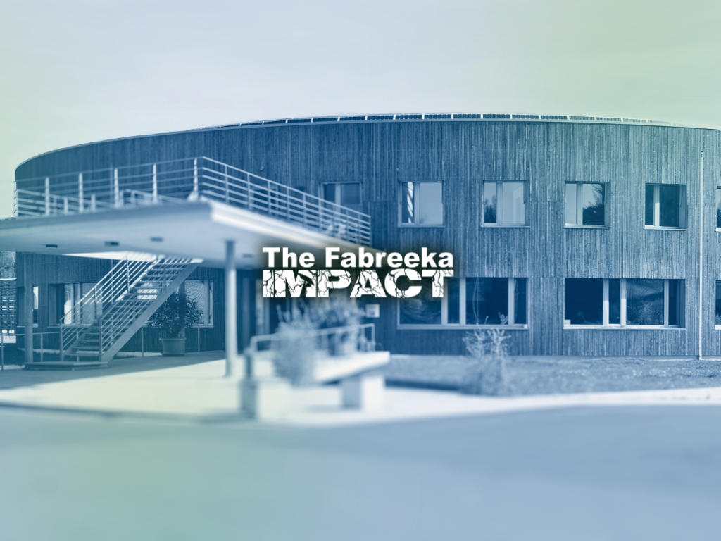 The Fabreeka Impact logo in front of a passive house complex.